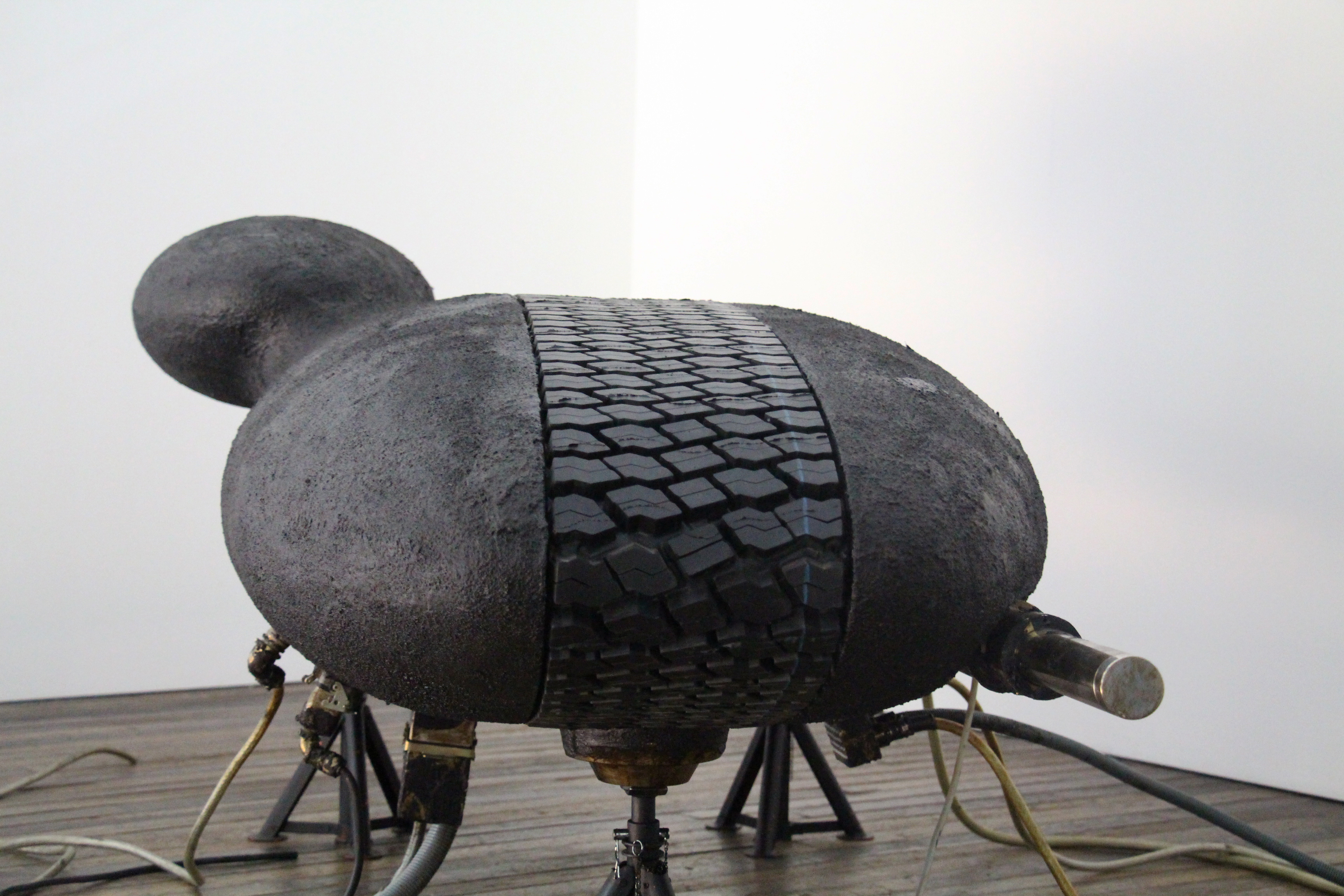 Carlo Borer, Capsule 2, 2016
Polyester, Stainless Steel, Tire, Bitumen
230 L x 115 W x 95 H cm 
Unique